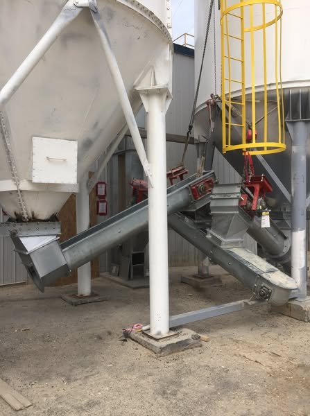 Elevator and conveyor on wood pellet silo for LG Granules pellet plant in Quebec — complete forestry biomass handling system